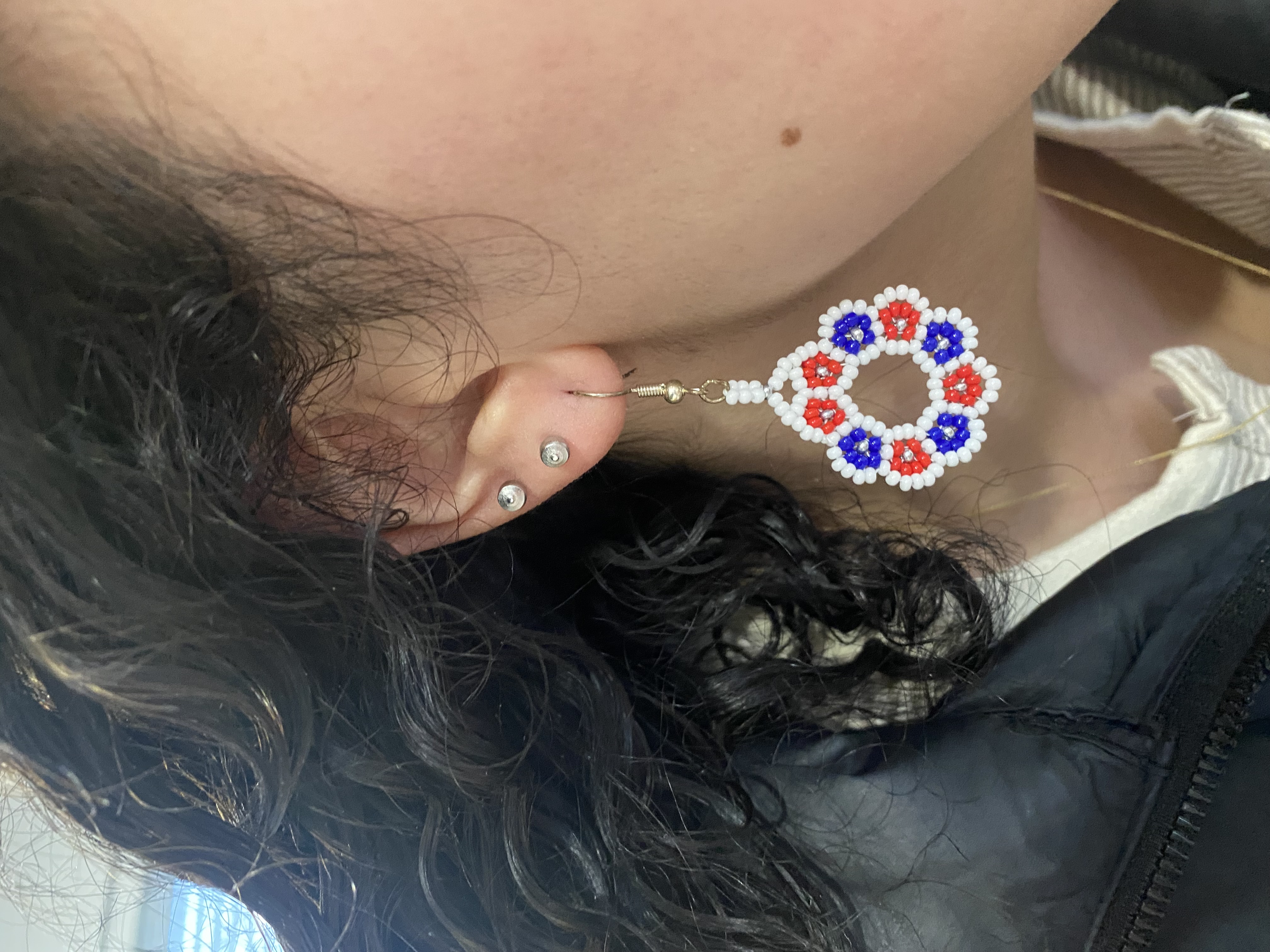 Customer wearing patriotic earrings